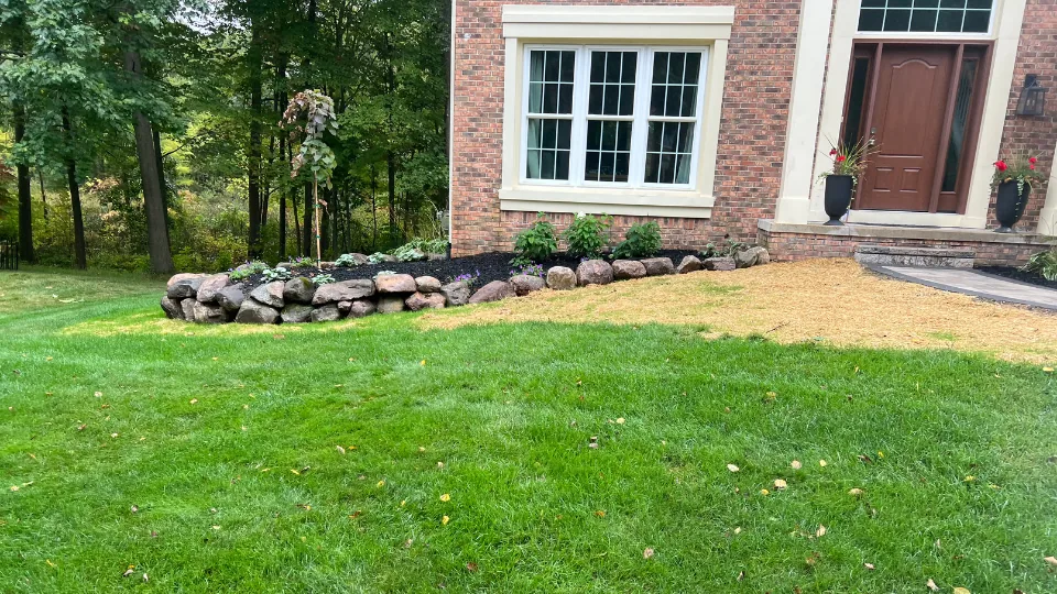 Decorative Flat Stone Brick Paver Walkway With Stair and Boulder Bordered Mulched Flower Beds