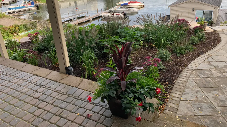 Landscaped Flower Bed & Brick Pavers On Lake