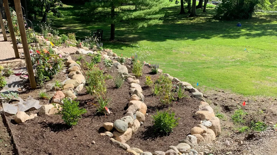 Landscaped Flower Bed With Decorative Boulders