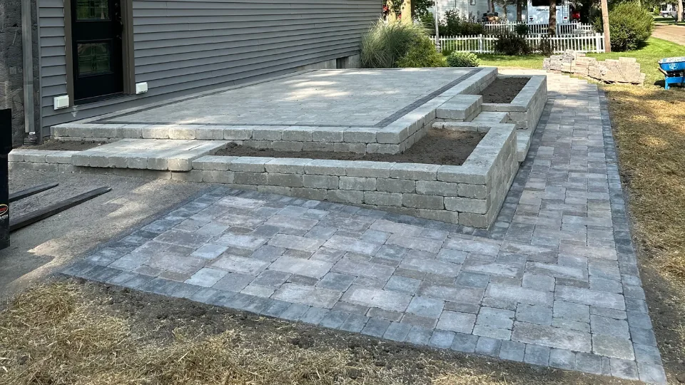Brick Paver Raised Patio With Stairs