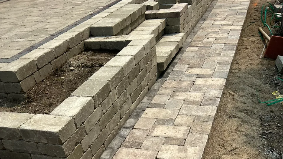 Retaining Wall With Brick Paver Patio and Steps